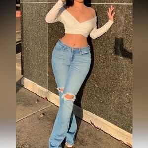 Mid rise distress light blue jeans